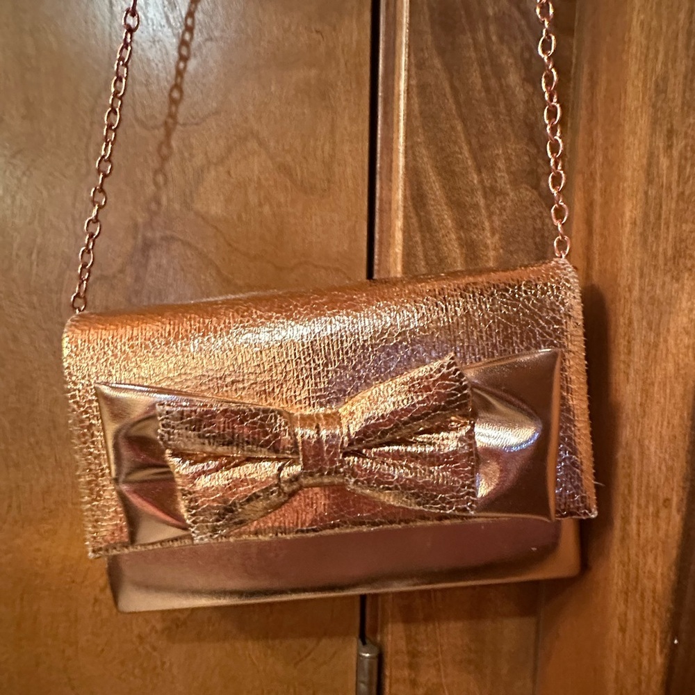 Charming Charlie Gold Bow Clutch Wristlet